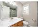 Updated bathroom features a new vanity with stone countertop and walk-in shower at 1561 Brookfield Cir, Franklin, IN 46131