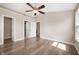 Spacious bedroom featuring new floors, a ceiling fan, and a walk-in closet at 1561 Brookfield Cir, Franklin, IN 46131