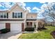 Charming townhome featuring a brick accent, attached garage, and well-maintained landscaping at 1561 Brookfield Cir, Franklin, IN 46131