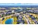 Aerial view of community featuring ponds, green spaces, and well-maintained homes creating a picturesque neighborhood setting at 16129 Brookhollow Dr, Westfield, IN 46062