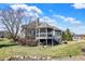 Home's backyard features a screened gazebo, outdoor seating, and a tranquil setting at 16129 Brookhollow Dr, Westfield, IN 46062
