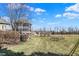 Picturesque backyard featuring a gazebo, mature trees, and a tranquil pond at 16129 Brookhollow Dr, Westfield, IN 46062