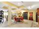 Finished basement with coffered ceiling, bar, seating area, and sporty decor at 16129 Brookhollow Dr, Westfield, IN 46062