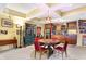 Basement featuring bar with wood cabinets, stainless steel refrigerator, and adjacent table at 16129 Brookhollow Dr, Westfield, IN 46062