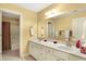 Bathroom featuring a double vanity, large mirror, and separate shower and toilet at 16129 Brookhollow Dr, Westfield, IN 46062