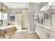 Bright bathroom boasts tile floors, double vanity, tub, and separate glass enclosed shower at 16129 Brookhollow Dr, Westfield, IN 46062