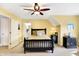 Bright bedroom with a ceiling fan, soft carpet and warm yellow walls at 16129 Brookhollow Dr, Westfield, IN 46062