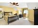Bright bedroom with a ceiling fan, soft carpet and warm yellow walls at 16129 Brookhollow Dr, Westfield, IN 46062