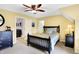Bright bedroom with a ceiling fan, soft carpet and warm yellow walls at 16129 Brookhollow Dr, Westfield, IN 46062