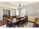 Stunning dining room featuring stylish lighting, and seating for eight provides ample space for entertaining guests at 16129 Brookhollow Dr, Westfield, IN 46062