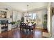 Spacious dining room features wood floors, large windows with shutters, and classic decor at 16129 Brookhollow Dr, Westfield, IN 46062