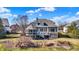 Lovely home exterior features a deck, screened porch and well-maintained backyard near the pond at 16129 Brookhollow Dr, Westfield, IN 46062