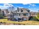 Desirable home exterior boasts an outdoor deck, screened porch, and serene views of pond at 16129 Brookhollow Dr, Westfield, IN 46062