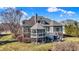 This home's backyard is complete with a screened in porch, a deck, and a pond view at 16129 Brookhollow Dr, Westfield, IN 46062