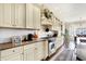 Spacious kitchen features granite countertops, tile backsplash, and modern stainless steel appliances at 16129 Brookhollow Dr, Westfield, IN 46062