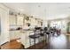 Bright kitchen with a large island, bar seating, custom cabinets, and stainless steel appliances at 16129 Brookhollow Dr, Westfield, IN 46062