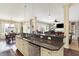 Open concept kitchen with granite counters, stainless dishwasher, and breakfast bar seating at 16129 Brookhollow Dr, Westfield, IN 46062