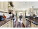 Open kitchen features granite countertops, stainless appliances and connects to a dining area at 16129 Brookhollow Dr, Westfield, IN 46062