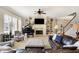 Inviting living room features comfortable seating, a fireplace, built-in shelves, and a grand piano at 16129 Brookhollow Dr, Westfield, IN 46062