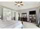 Serene main bedroom features neutral tones, plush carpet, and ensuite bathroom access at 16129 Brookhollow Dr, Westfield, IN 46062