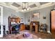Well-lit office space with coffered ceiling, wood furniture, and a comfortable rug at 16129 Brookhollow Dr, Westfield, IN 46062