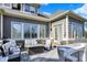Inviting outdoor patio featuring comfortable seating, a fire table, and elegant stone accents for relaxing and entertaining at 16129 Brookhollow Dr, Westfield, IN 46062