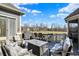 Relaxing outdoor patio with grill and outdoor seating overlooking a pond, perfect for entertaining and enjoying the serene views at 16129 Brookhollow Dr, Westfield, IN 46062