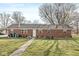 Backyard brick house featuring a path, mature trees, and a picnic table at 1636 N County Road 425 E, Avon, IN 46123
