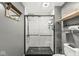 Bright bathroom featuring a glass shower enclosure, white subway tile, shelving, and modern fixtures at 1636 N County Road 425 E, Avon, IN 46123