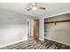 Simple bedroom featuring light walls, a ceiling fan, wood-look flooring, and a large closet at 1636 N County Road 425 E, Avon, IN 46123