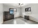 Neutral toned bedroom with dark furnishings, wood floors, a ceiling fan, and natural light from two windows at 1636 N County Road 425 E, Avon, IN 46123