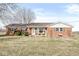 Charming single story brick home with mature landscaping, a covered front porch, and large front yard at 1636 N County Road 425 E, Avon, IN 46123