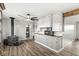 Inviting living room with wood-burning stove, wood flooring, and built-in storage, creating a cozy atmosphere at 1636 N County Road 425 E, Avon, IN 46123