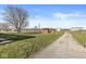Large grassy property featuring mature trees and various outbuildings at 1636 N County Road 425 E, Avon, IN 46123