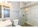 Bathroom featuring a glass enclosed shower, toilet, and modern vanity at 1653 S Delaware St, Indianapolis, IN 46225