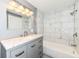 Modern bathroom with marble countertop, and sleek bathtub with tiled shower for relaxation at 1653 S Delaware St, Indianapolis, IN 46225