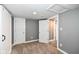 Carpeted bedroom with gray walls, white trim, recessed lighting, and two closets at 1653 S Delaware St, Indianapolis, IN 46225