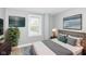 Stylish bedroom with modern decor, a large window, and a comfortable bed for a peaceful retreat at 1653 S Delaware St, Indianapolis, IN 46225