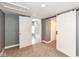 Carpeted bedroom with gray walls, recessed lighting, barn door, and attached bath at 1653 S Delaware St, Indianapolis, IN 46225