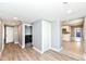 Hallway with modern flooring that provides seamless transition to the nearby kitchen and laundry areas at 1653 S Delaware St, Indianapolis, IN 46225