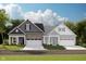 Charming two-story home with brick and siding, featuring a two-car garage and well-manicured lawn at 17220 Cole Evans Dr, Noblesville, IN 46060