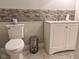 Bathroom features a modern toilet and vanity combo on a marble floor at 1921 W Michigan St, Indianapolis, IN 46222