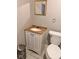 Bathroom featuring a modern toilet, new vanity, and mirror at 1921 W Michigan St, Indianapolis, IN 46222