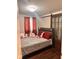 Bedroom features plush decor and a sliding barn door accent, providing warmth and character at 1921 W Michigan St, Indianapolis, IN 46222