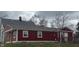 Rear exterior view of the home, featuring white trim and a wooden deck at 1921 W Michigan St, Indianapolis, IN 46222