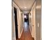 Hallway view with wood floors and door frames showcases architecture at 1921 W Michigan St, Indianapolis, IN 46222