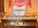 Close-up of the kitchen sink with granite counters, decorative backsplash and stainless steel faucet at 1921 W Michigan St, Indianapolis, IN 46222