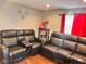 Inviting living room with modern decor, laminate flooring, and stylish furniture at 1921 W Michigan St, Indianapolis, IN 46222