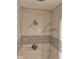 Close-up of a tiled shower stall with upscale fixtures at 1921 W Michigan St, Indianapolis, IN 46222