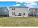 A well maintained backyard with a concrete patio and outdoor seating for relaxing and entertaining at 19970 Edwick Dr, Westfield, IN 46074